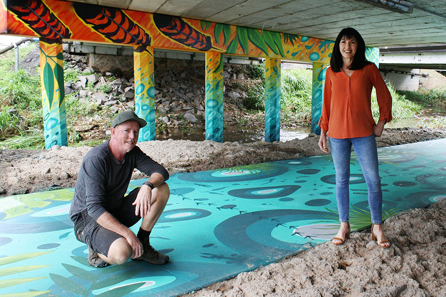 Artist Daniel (Wally) Wallwork and Division 3 Councillor Cathy Zeiger at the Gordon Creek underpass