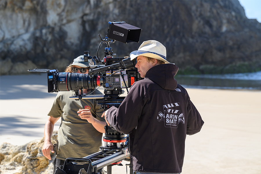 Darby and Joan camera crew film a scene on the beach