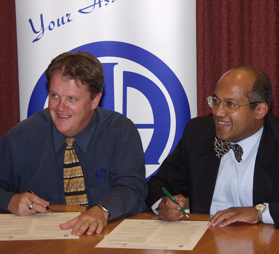 Signing the Roads Protocol withMain Roads Director 
General Jim Varghese